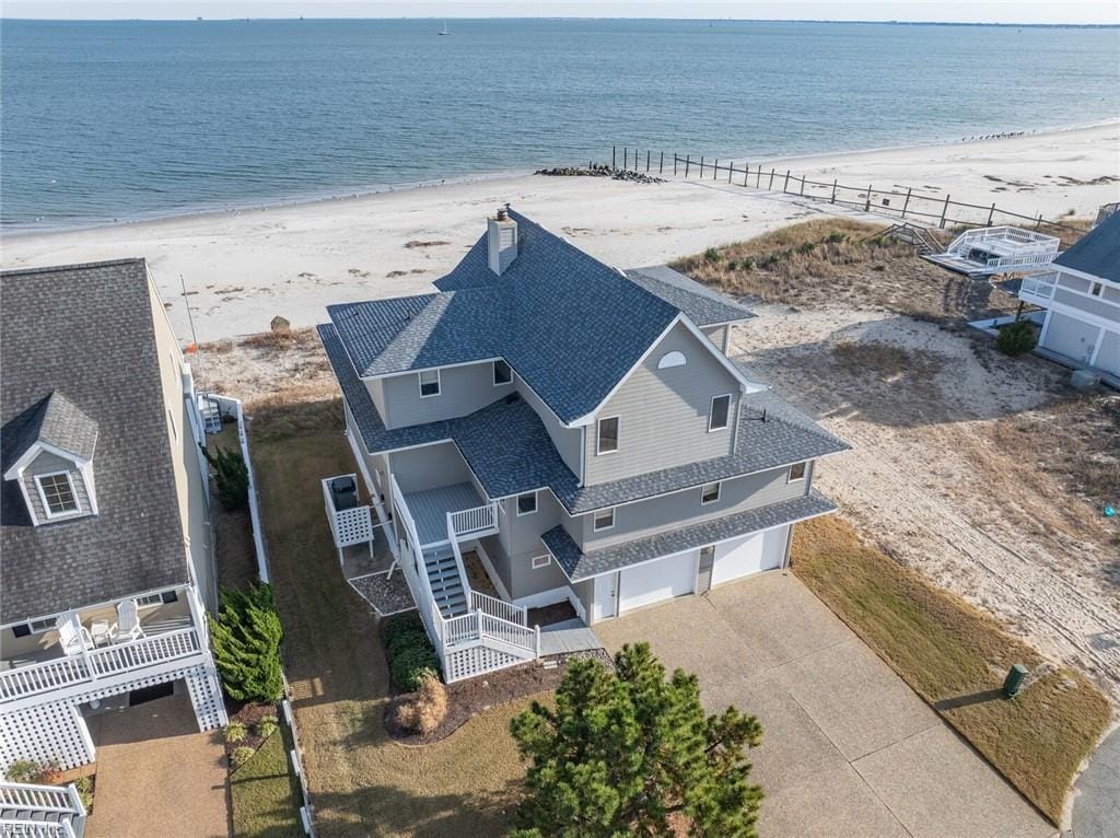 aerial view featuring a water view and a view of the beach