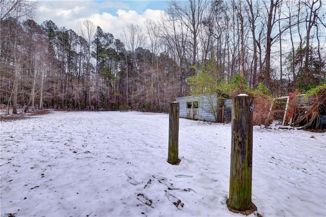 view of yard layered in snow