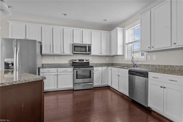 kitchen with stainless steel appliances and white cabinetry