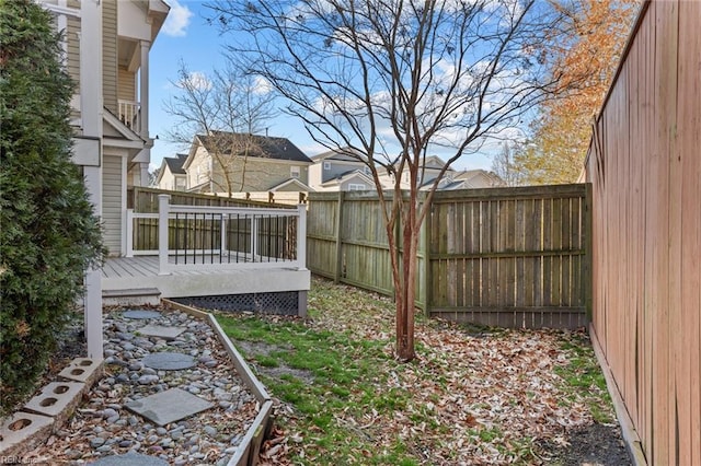 view of yard featuring a wooden deck