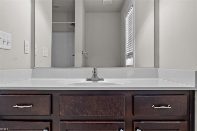 bathroom with vanity and plenty of natural light