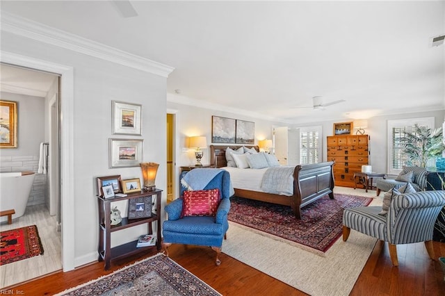 bedroom with ornamental molding, ceiling fan, and wood-type flooring