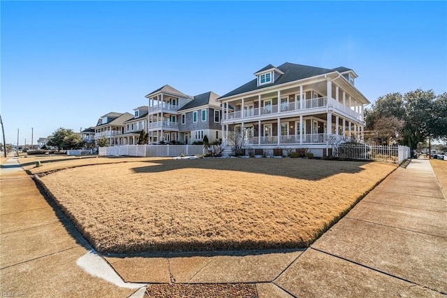 view of front of house with a porch and a balcony