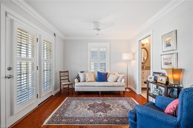 living room with sink, ceiling fan, crown molding, and dark hardwood / wood-style floors