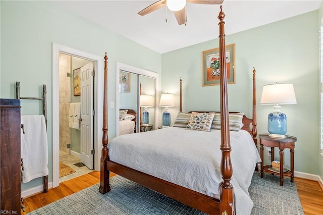 bedroom featuring ceiling fan, connected bathroom, and hardwood / wood-style floors