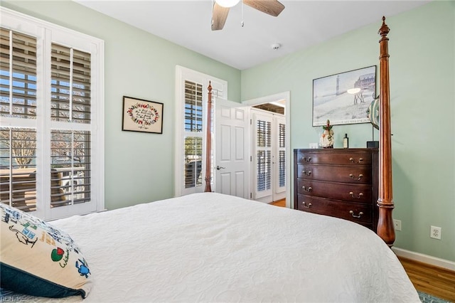 bedroom featuring access to outside, ceiling fan, and hardwood / wood-style flooring