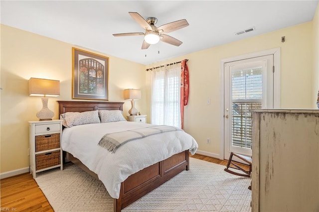 bedroom with access to outside, ceiling fan, and light hardwood / wood-style flooring