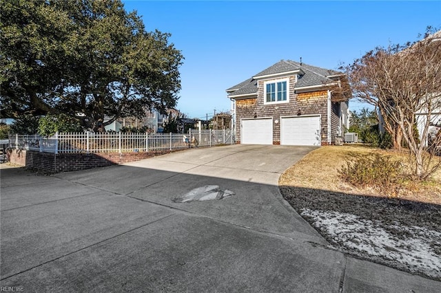 view of property exterior featuring central AC unit and a garage