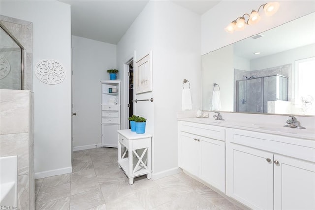 bathroom featuring vanity and a shower with shower door