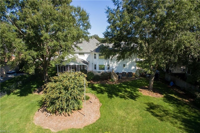 view of yard featuring a sunroom