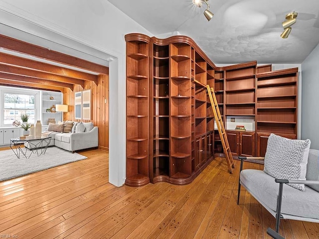 sitting room with vaulted ceiling and light hardwood / wood-style floors