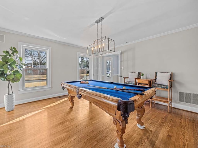 playroom with french doors, pool table, ornamental molding, and hardwood / wood-style flooring