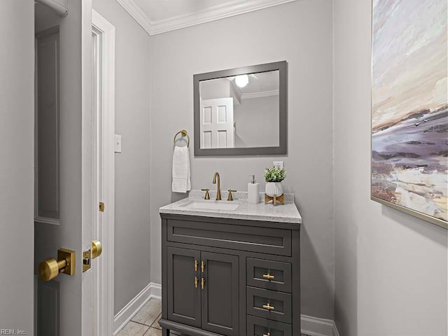 bathroom featuring tile patterned floors, crown molding, and vanity