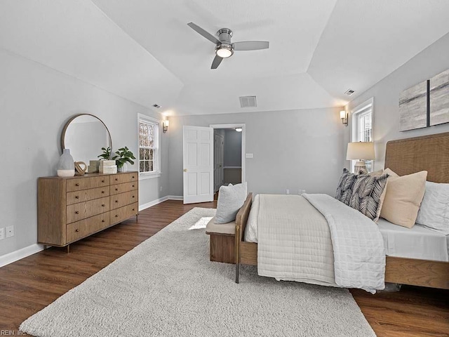 bedroom with lofted ceiling, dark wood-type flooring, and ceiling fan