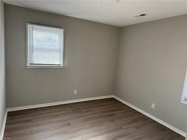 unfurnished room featuring hardwood / wood-style floors