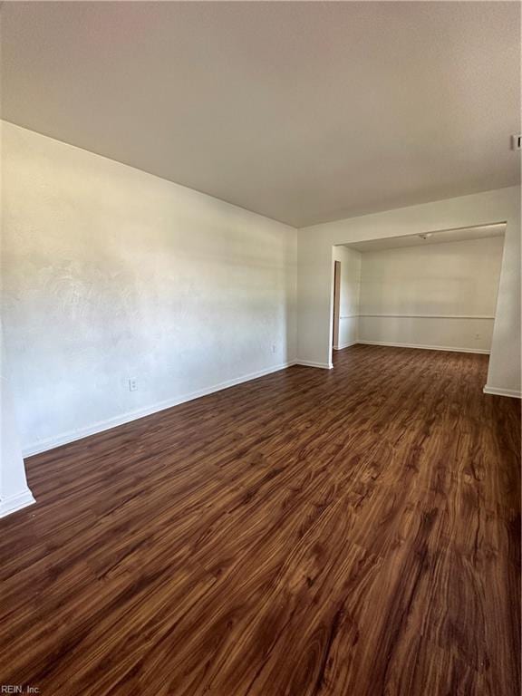 spare room featuring dark hardwood / wood-style flooring