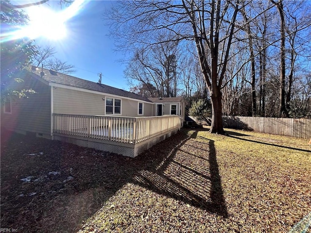 back of house featuring a wooden deck