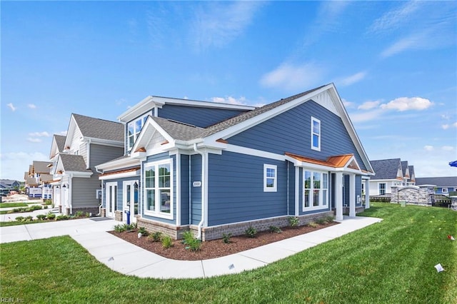 view of side of property with a lawn