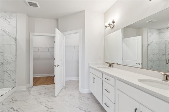 bathroom with vanity and an enclosed shower