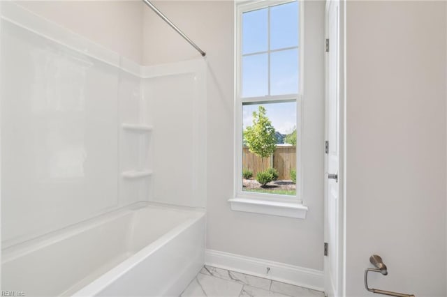 bathroom with bathing tub / shower combination