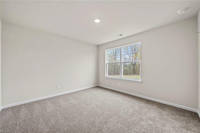 spare room featuring carpet floors