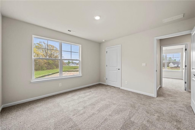 unfurnished bedroom with light carpet