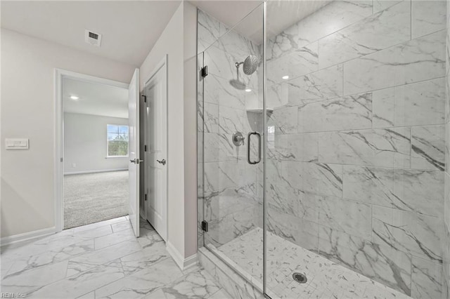 bathroom featuring an enclosed shower