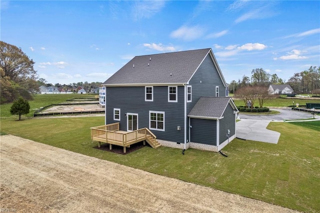 back of house with a lawn and a wooden deck