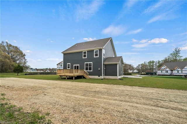 back of property featuring a deck and a yard