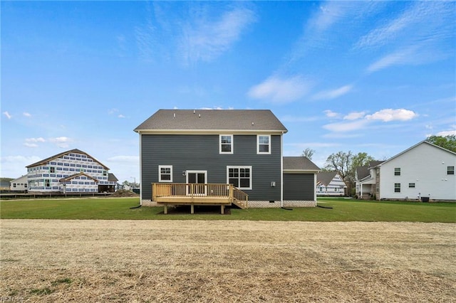 rear view of house with a yard and a deck