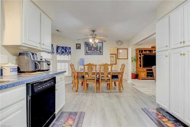 dining room with ceiling fan and light hardwood / wood-style floors