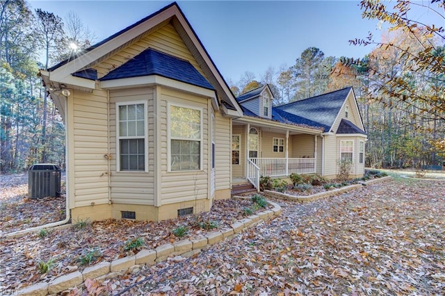 view of front of property featuring covered porch and central AC unit