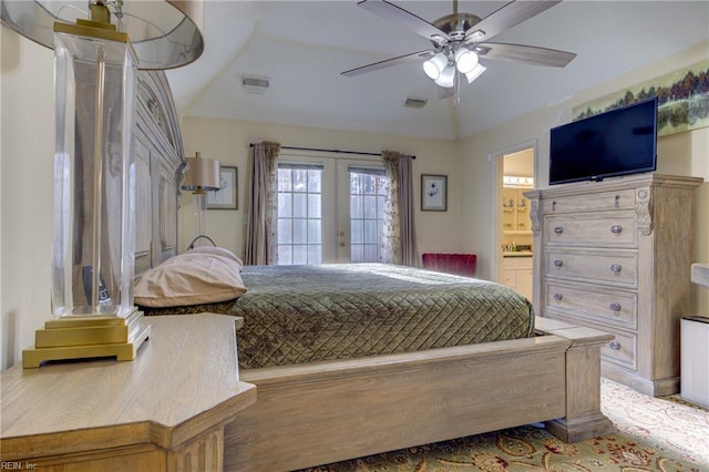 bedroom with ceiling fan, ensuite bath, french doors, and vaulted ceiling