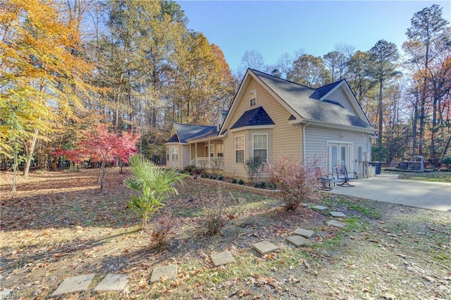 view of side of property with french doors and a patio