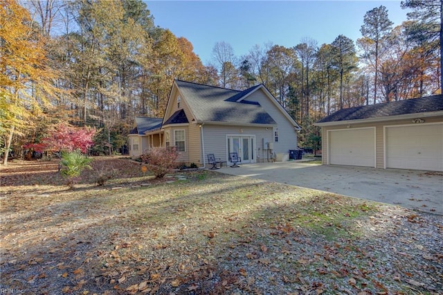 view of side of property featuring french doors