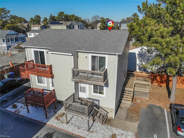 view of front of home featuring a balcony