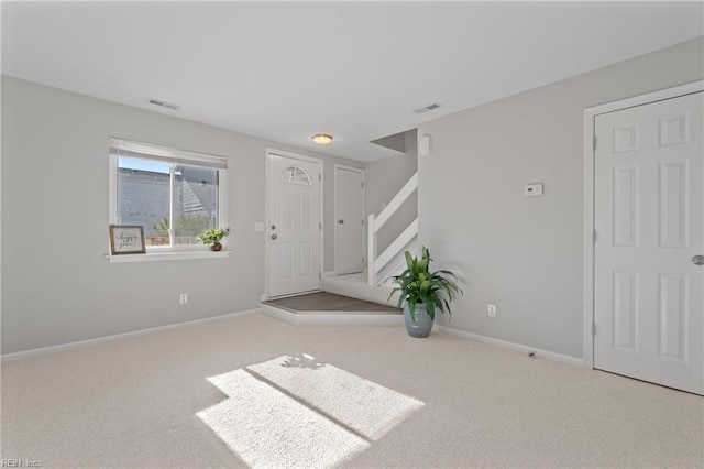 interior space featuring light colored carpet