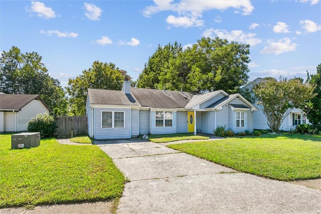 ranch-style home featuring a front yard