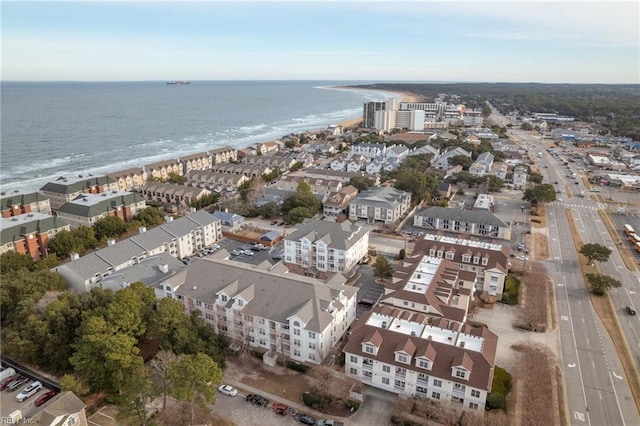 birds eye view of property featuring a view of the beach and a water view