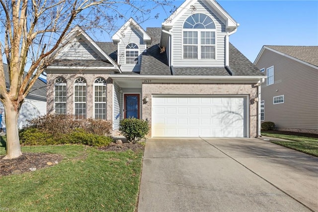 front of property with a front lawn and a garage