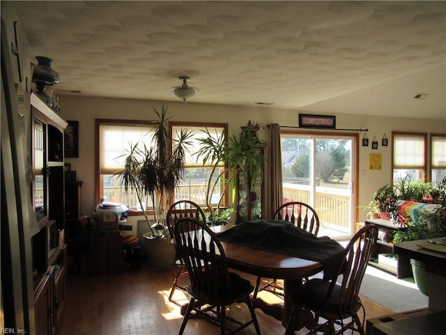 dining area with hardwood / wood-style floors