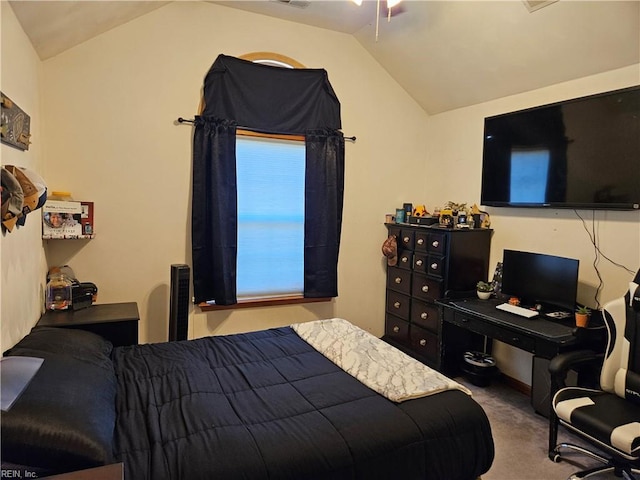 carpeted bedroom with vaulted ceiling