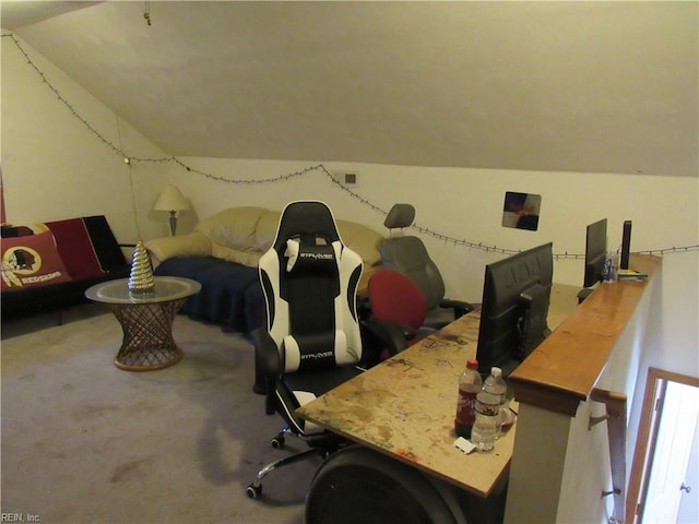 carpeted office space with vaulted ceiling