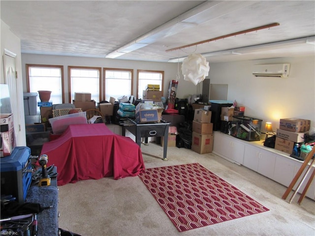 interior space featuring light colored carpet and a wall mounted AC