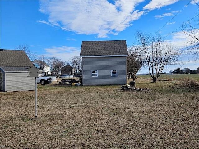 view of side of property with a lawn