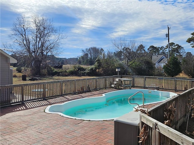 view of pool featuring a patio area