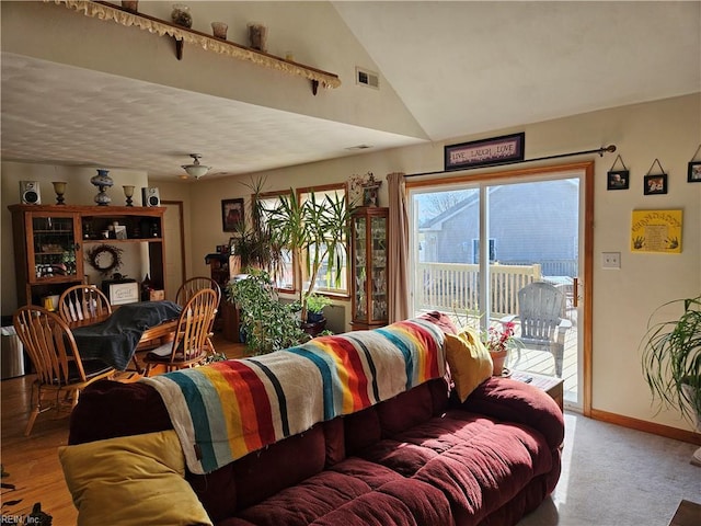 bedroom with access to exterior and lofted ceiling