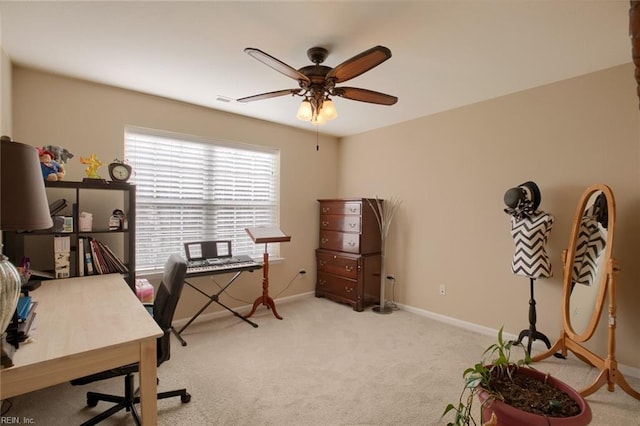 office space featuring ceiling fan and light colored carpet