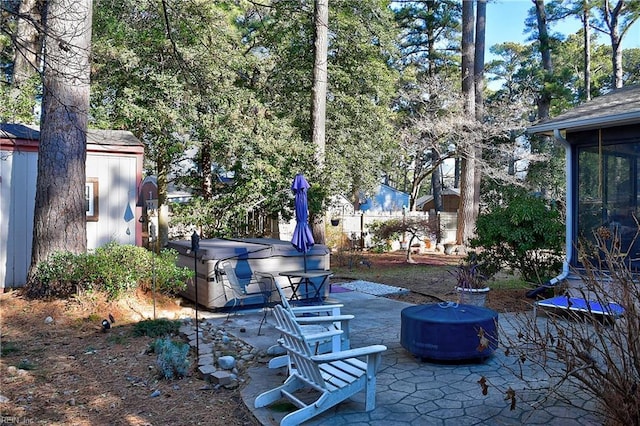 view of patio featuring a sunroom and a hot tub