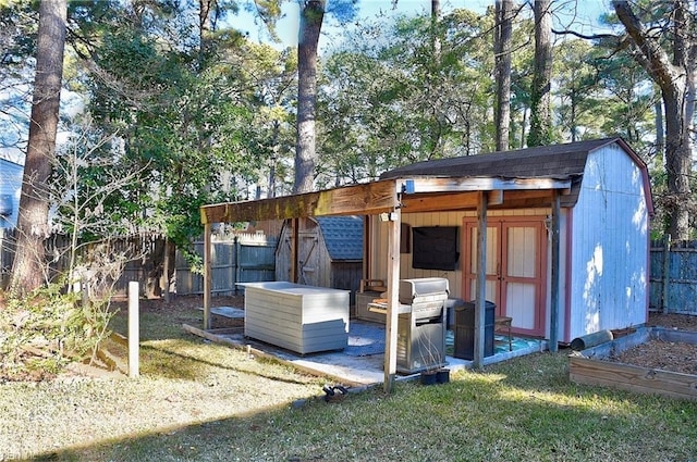 view of outbuilding with a lawn